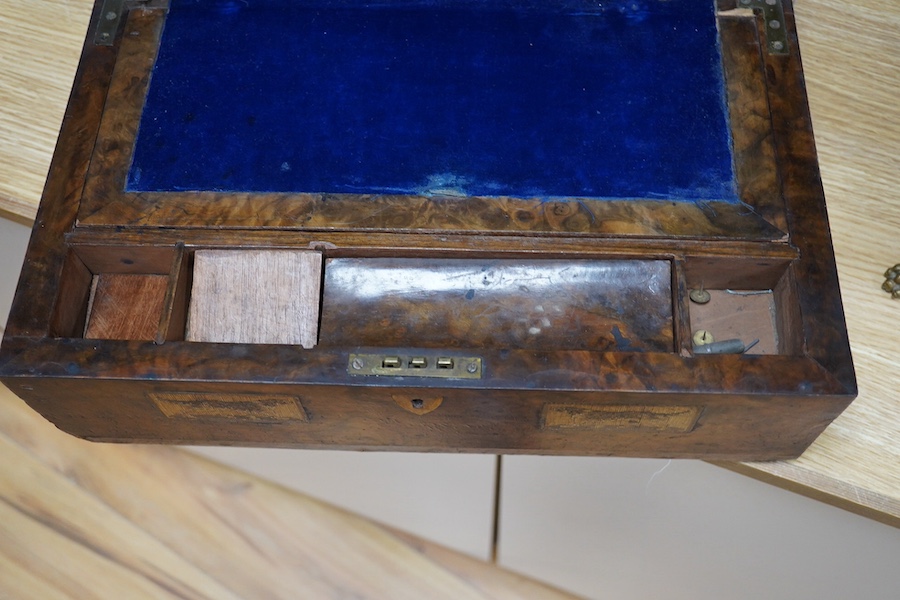 A Victorian writing slope, painted with a panel of a ship in full sail. 39cm wide x 17 cm high. Condition - top cracked